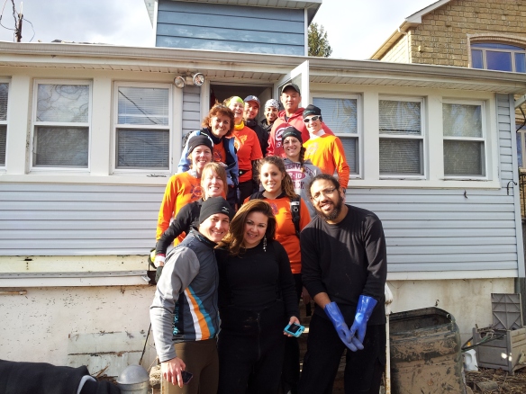 Chicago resident Andrea Hutchins planned to run the NYC marathon this year, but when she found out the race was cancelled she and her friends and family went to Staten Island and helped a NYC Police officer start rebuilding his home in Midland Beach.Photo Credit: Andrea Hutchins